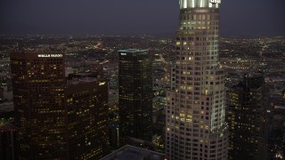 AX69_083 - 4.8K aerial stock footage fly over Two California Plaza in Downtown Los Angeles to reveal office buildings at night, California