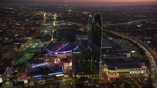AX69_092 - 4.8K stock footage aerial video of Staples Center, JW Marriott, and The Ritz-Carlton in Downtown Los Angeles, California at twilight