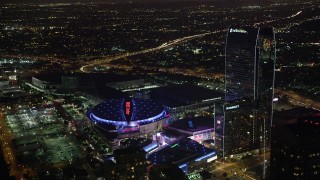 AX69_125 - 4.8K aerial stock footage of Staples Center, Nokia Theater and Ritz-Carlton in Downtown Los Angeles, California at night