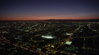 AX69_133 - 4.8K aerial stock footage of Contreras High School Stadium at night in Westlake, Los Angeles, California