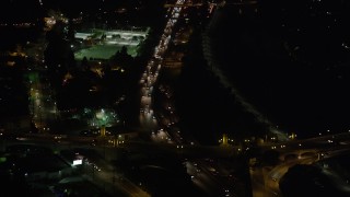AX69_137 - 4.8K aerial stock footage of heavy traffic on Interstate 5 through Los Feliz, Los Angeles, California