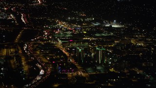 AX69_142 - 4.8K aerial stock footage approach Holiday Inn and Burbank Town Center in Burbank, California at night