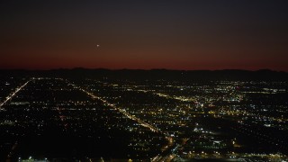 AX69_144 - 4.8K aerial stock footage of suburban neighborhoods at nighttime in Burbank, California