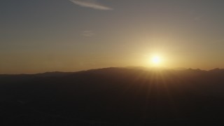 AX70_001 - 4K stock footage aerial video Sunrise over the mountains