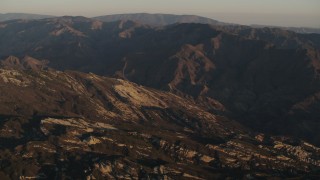 AX70_013 - 4K aerial stock footage Rugged slopes and mountain ridge at sunrise in Los Padres National Forest, California