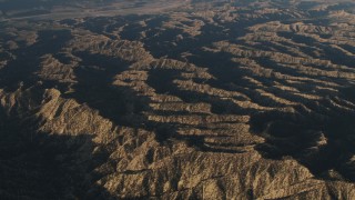 AX70_019 - 4K aerial stock footage Pass mountain ridges in Los Padres National Forest at sunrise, California