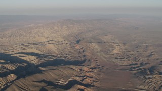 AX70_033 - 4K aerial stock footage Mountain range at sunrise, Cuyama, California
