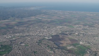 AX70_084 - 4K aerial stock footage Farm fields and suburban neighborhoods in Salinas, California