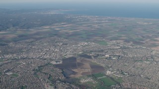 AX70_085 - 4K aerial stock footage Farm fields around suburban neighborhoods in Salinas, California