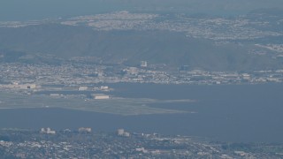 AX70_097 - 4K stock footage aerial video Commercial jet flying by San Francisco International Airport in California
