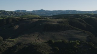AX70_099 - 4K aerial stock footage Green hills in springtime, Gilroy, California