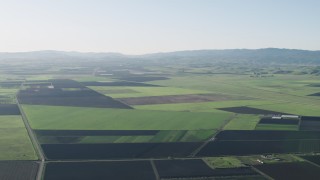 AX70_104 - 4K aerial stock footage Fly over large crop fields in Hollister, California