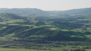 AX70_113 - 4K aerial stock footage Approach farms and green hills in Hollister, California