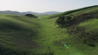 AX70_124 - 4K stock footage aerial video Green hills in Hollister, California