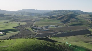 AX70_131 - 4K aerial stock footage Fly over hilltop to reveal the Blossom Hill Winery in Paicines, California