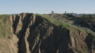 AX70_158 - 4K aerial stock footage Passing a rugged hillside in Paicines, California