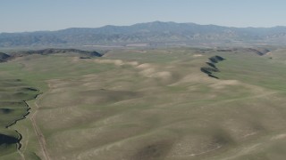 AX70_167 - 4K aerial stock footage Rolling green hills in San Benito County, California
