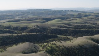 AX70_178 - 4K aerial stock footage Dirt roads crossing over hills in San Benito County, California