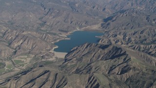 AX70_186 - 4K stock footage aerial video of Santa Felicia Dam and Lake Piru in Los Padres National Forest, California