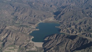 AX70_188 - 4K aerial stock footage Flying by the Santa Felicia Dam and Lake Piru in the Los Padres National Forest, California