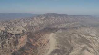 AX70_203 - 4K aerial stock footage Flyby a rugged desert mountains in the Caliente Mountain Range, California