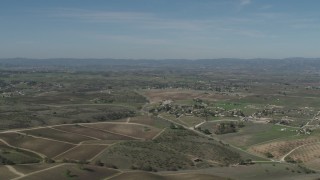 AX70_226 - 4K aerial stock footage Flyby rural homes and vineyards in Paso Robles, California