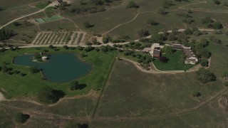 AX70_229 - 4K aerial stock footage Upscale home and a pond in Paso Robles, California