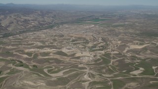 AX70_233 - 4K aerial stock footage Approaching oil fields in San Ardo, California