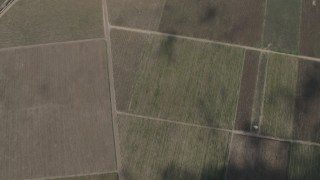 AX70_247 - 4K aerial stock footage bird's eye view of crop fields in Greenfield, California