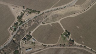 AX70_249 - 4K stock footage aerial video bird's eye view of crop fields around Arroyo Seco Road in Greenfield, California