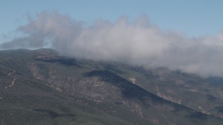 AX70_254 - 4K aerial stock footage Flyby low clouds over the Santa Lucia Range, California