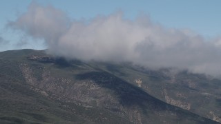AX70_255 - 4K aerial stock footage Passing low clouds over the Santa Lucia Range, California