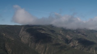 AX70_258 - 4K aerial stock footage Clouds on the summits of Santa Lucia Range mountains in California
