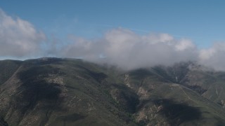 AX70_259 - 4K aerial stock footage Santa Lucia Range mountains capped by clouds in California