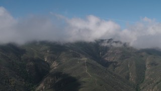AX70_260 - 4K aerial stock footage Cloud-capped Santa Lucia Range mountains in California