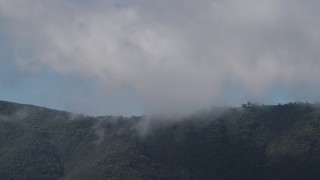 AX70_266 - 4K aerial stock footage of clouds over a Santa Lucia Range mountain ridge in California