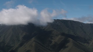 AX70_268 - 4K aerial stock footage of cloud beside a Santa Lucia Range mountain ridge in California