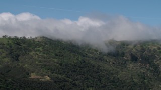 AX70_274 - 4K aerial stock footage of cloud-capped mountains in the Santa Lucia Range in California