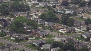 AX71_001E - 5.1K aerial stock footage of suburban neighborhoods in Massapequa Park, Long Island, New York