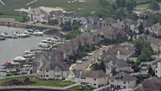 AX71_006 - 5.1K aerial stock footage flying by waterfront homes beside a canal, Seaford, Long Island, New York