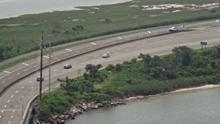 AX71_009 - 5.1K aerial stock footage tracking a sedan on Wantagh State Parkway, Long Island, New York