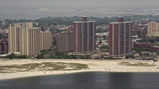 AX71_030E - 5.1K aerial stock footage of beachfront apartment buildings in Far Rockaway, Queens, New York