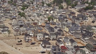 AX71_041E - 5.1K aerial stock footage flying past beachfront homes in Breezy Point, Queens, New York