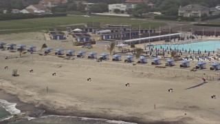 AX71_062 - 5.1K aerial stock footage flying by Deal Casino Beach Club cabanas in Deal, Jersey Shore, New Jersey