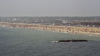 AX71_070 - 5.1K aerial stock footage of a crowded beach in Belmar, Jersey Shore, New Jersey