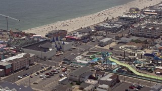 AX71_098E - 5.1K stock footage aerial video orbiting Breakwater Beach Waterpark and Casino Pier, Seaside Heights, Jersey Shore, New Jersey