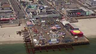 AX71_100E - 5.1K aerial stock footage of an amusement park on Casino Pier, Seaside Heights, Jersey Shore, New Jersey