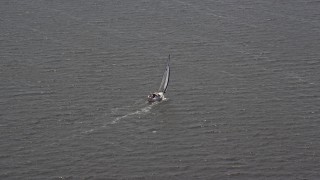 AX71_144 - 5.1K aerial stock footage of a sailboat in Ocean County, New Jersey