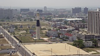 AX71_176 - 5.1K aerial stock footage flying by Absecon Light and Pacific Avenue in Atlantic City, New Jersey