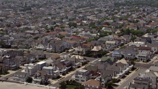 AX71_206 - 5.1K aerial stock footage of beautiful homes on the coast in Ventnor City, New Jersey